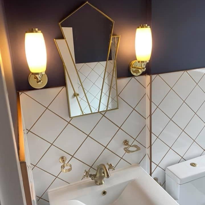 Dark blue and gold bathroom